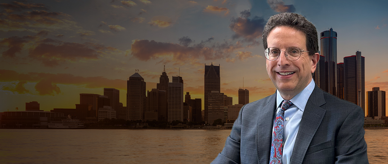 Attorney Michael I. Sherman, Esq. with a city skyline in the background